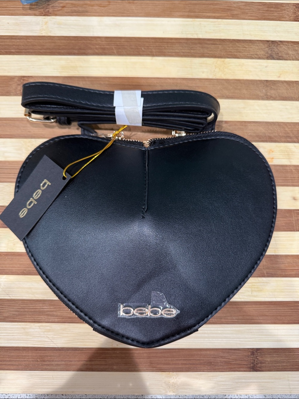 bebe Black Heart-Shaped Crossbody Bag with Gold Logo